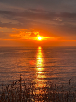 北海道の海に沈む夕日の写真のフリー素材